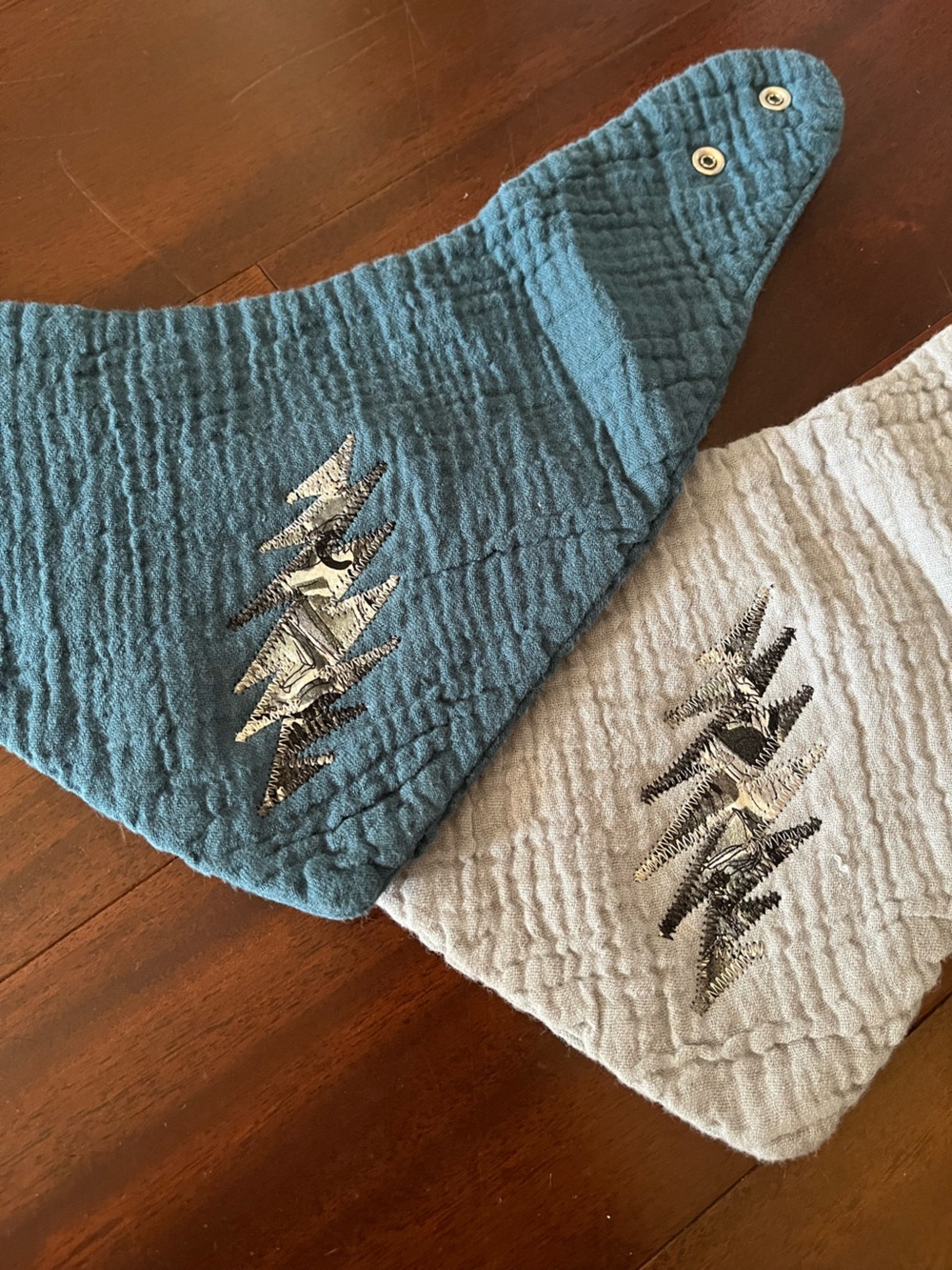 Baby bibs with stealie bolt patches made from Jerry’s silk art ties GRATEFUL